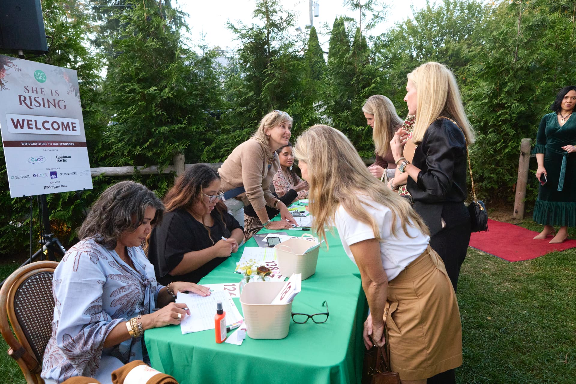 Guests checking in at the welcome table