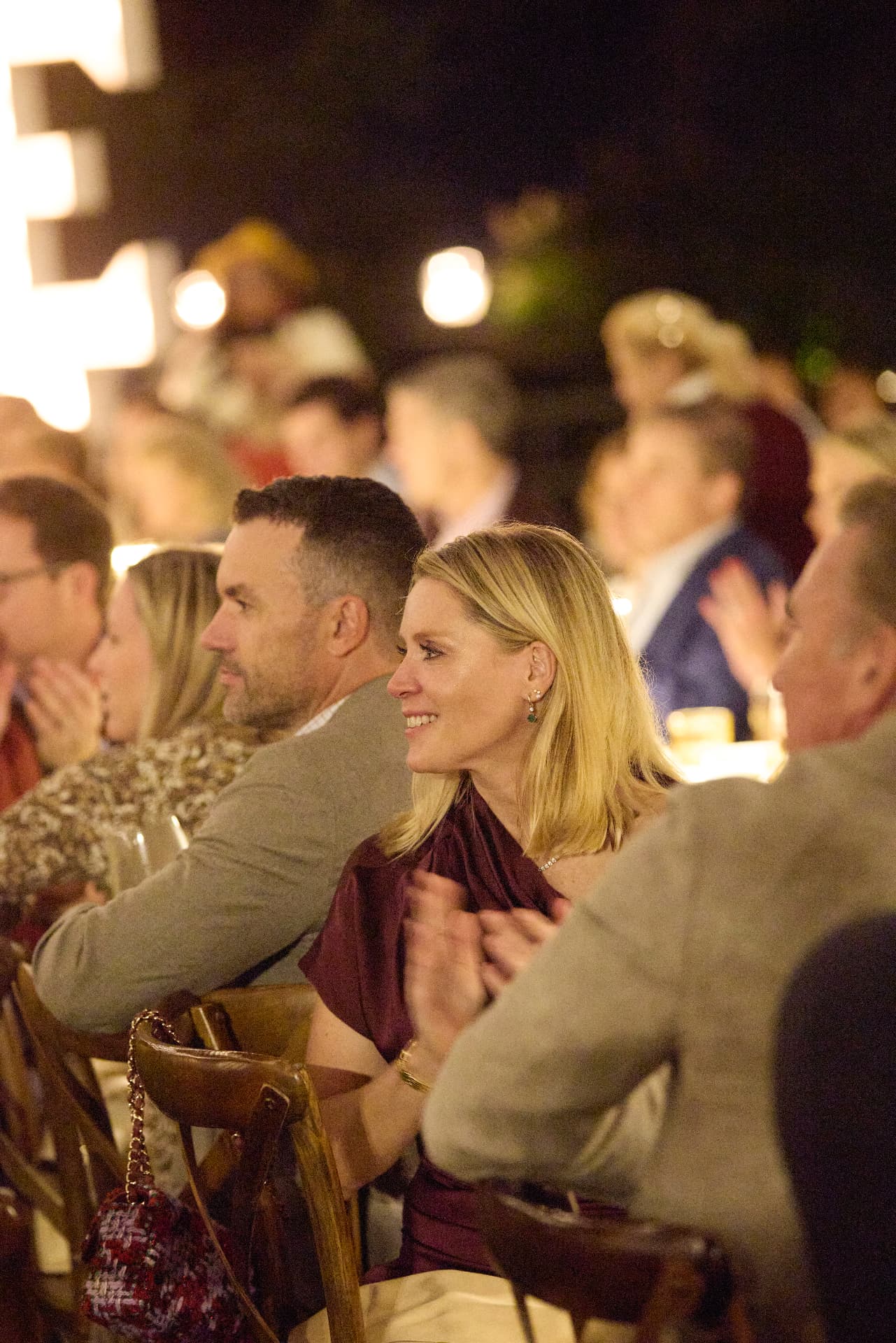 Guests applauding at dinner