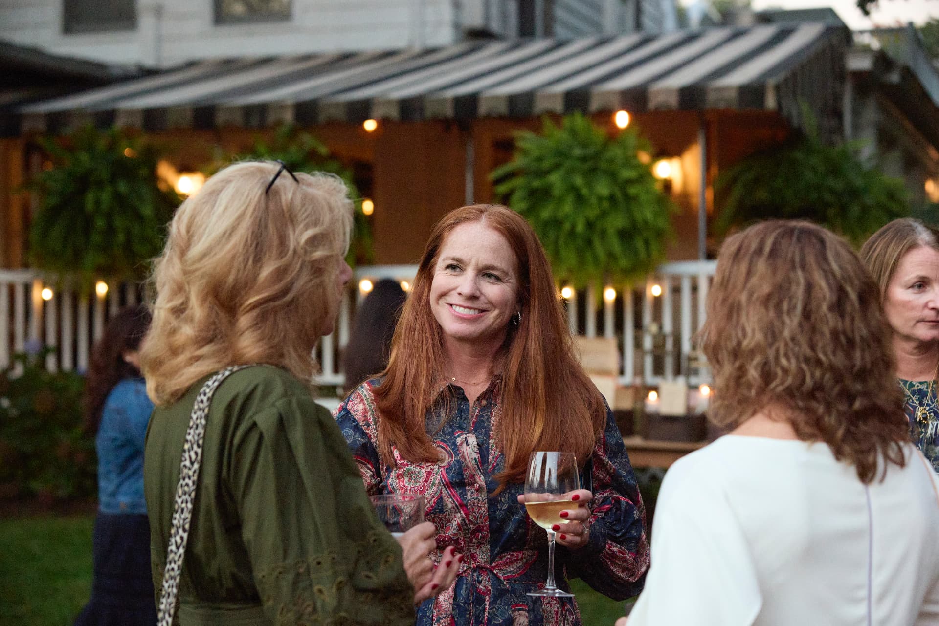 Friends reconnecting at the welcome reception