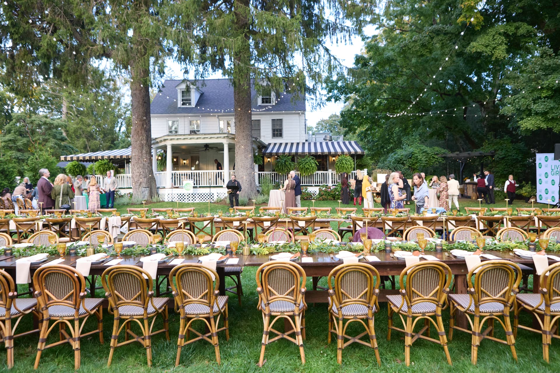 Long garden tables set before the Roger Sherman Inn