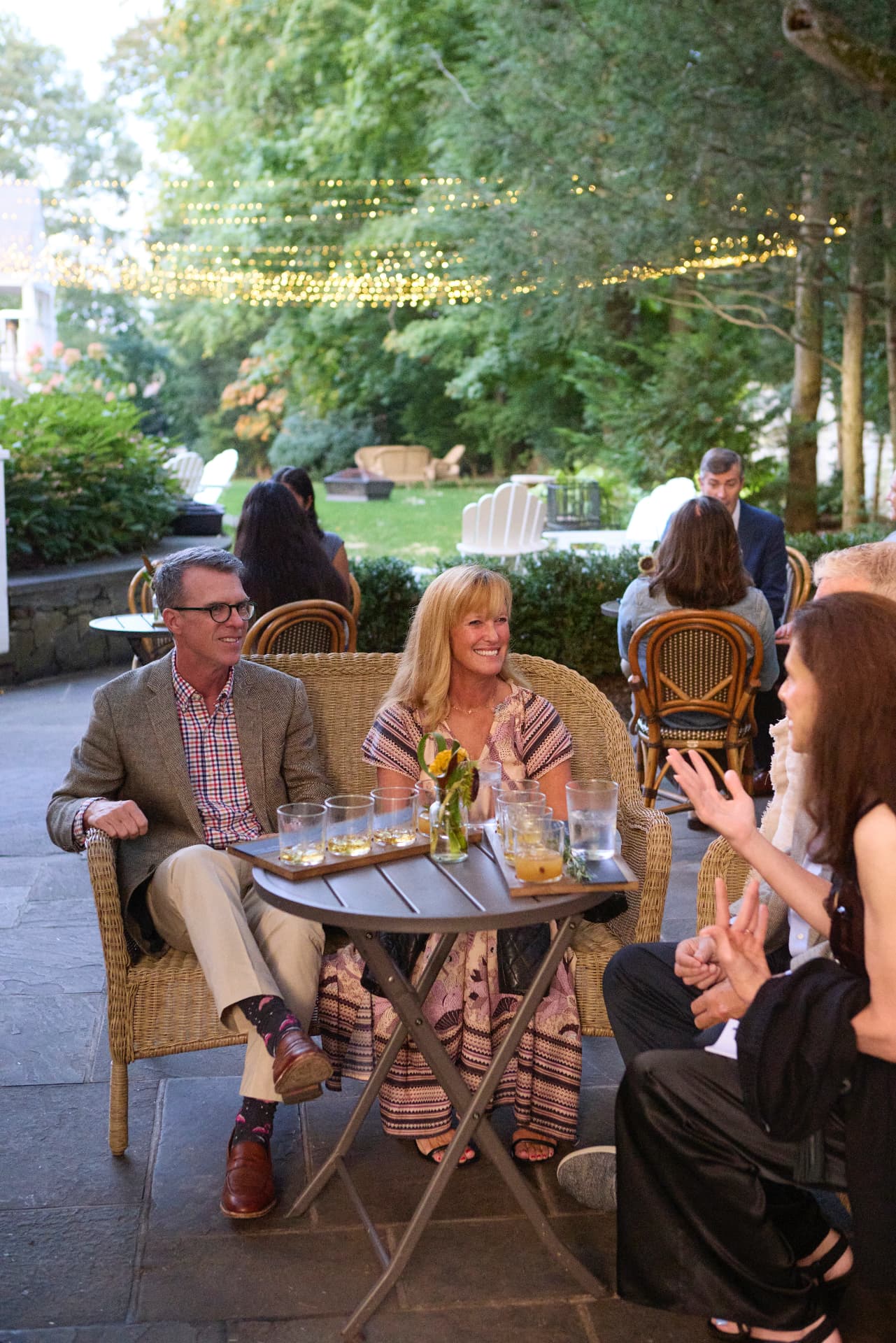 Guests relaxing on the terrace with tasting flights
