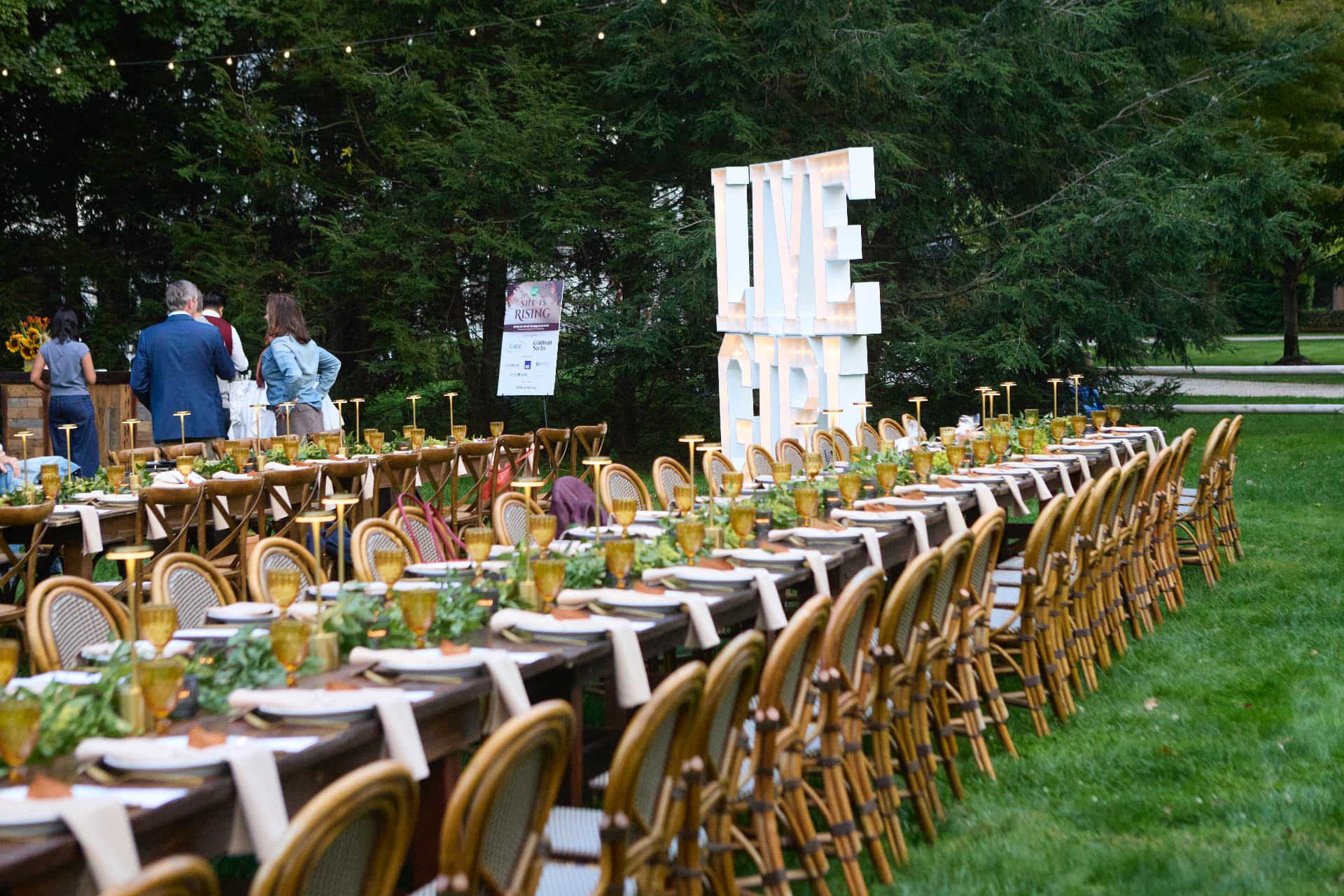 Garden tables set beside the LIVE letters