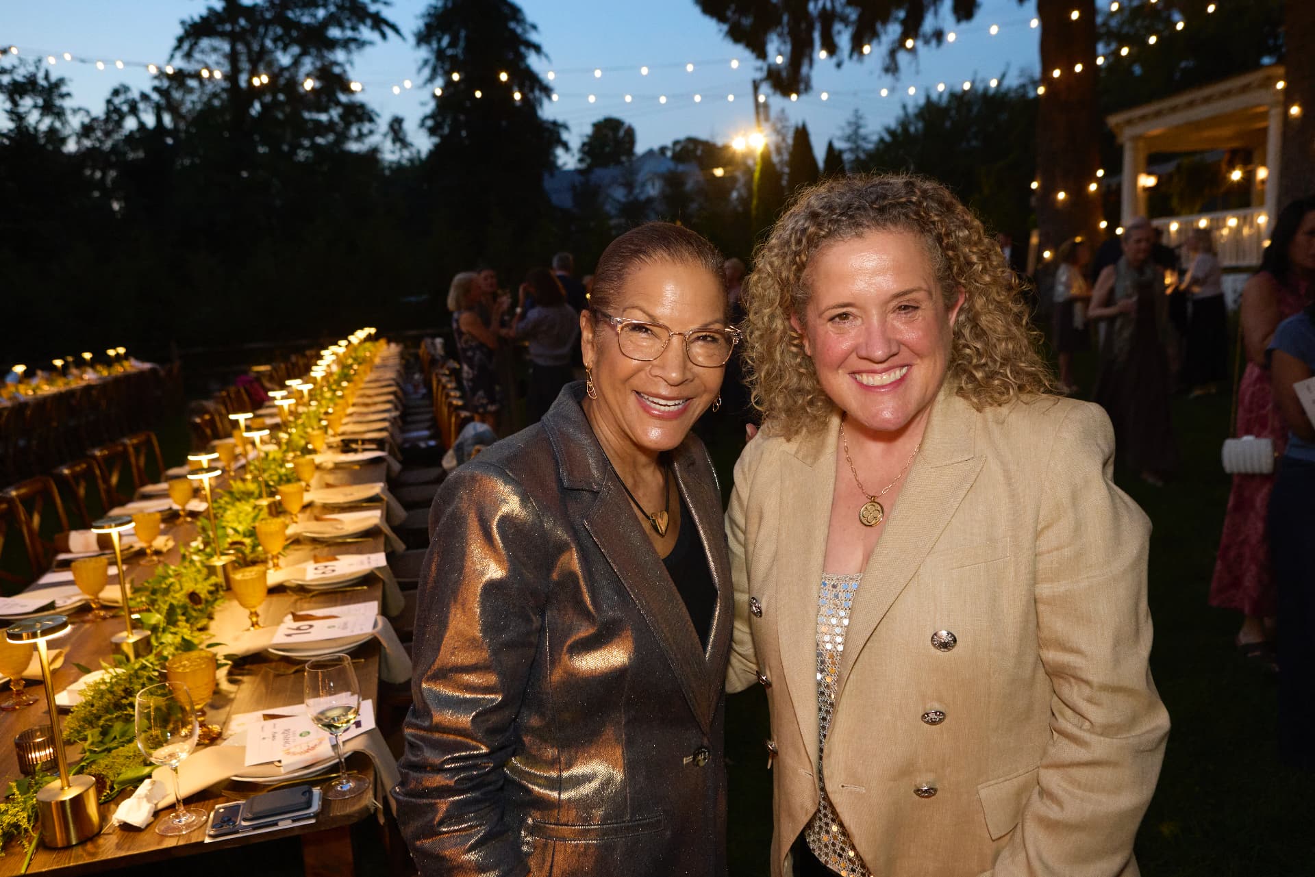 Board members Susan Johnson and Jill Popovich at their dinner table
