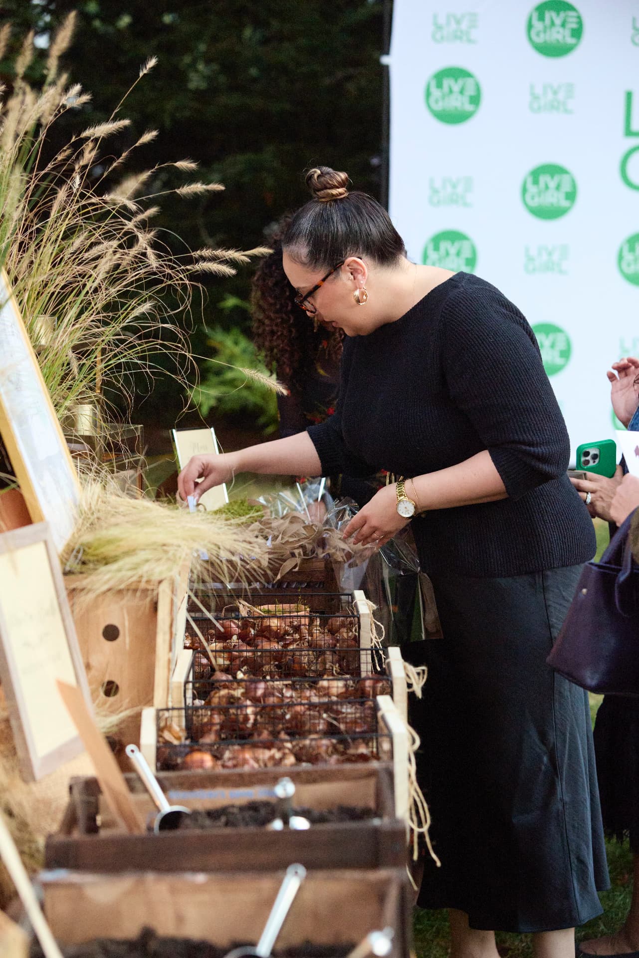 A guest choosing bulbs at the Bulb Bar