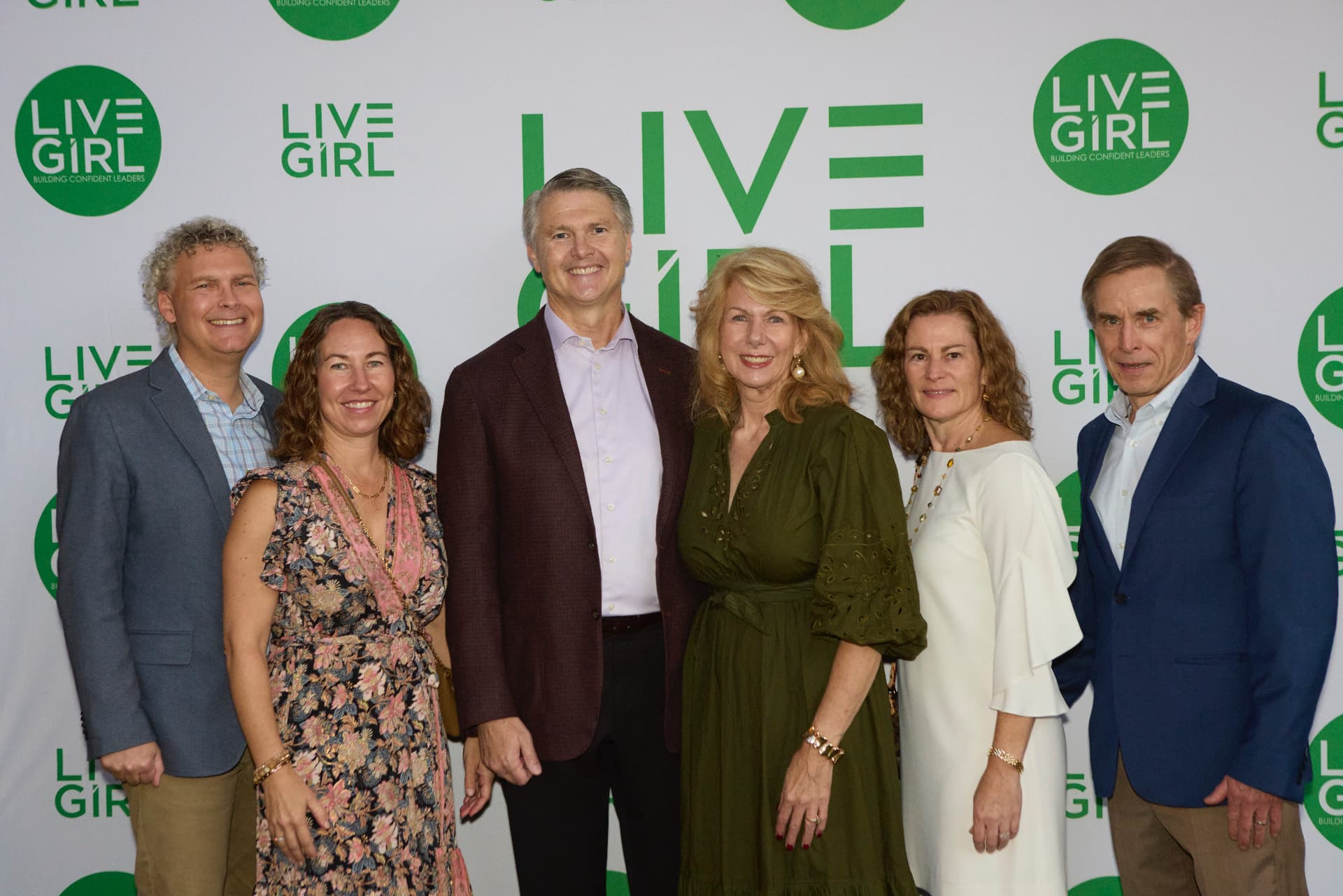 AXA XL CEO Scott Gunter with AXA colleagues and their wives at the LiveGirl step-and-repeat