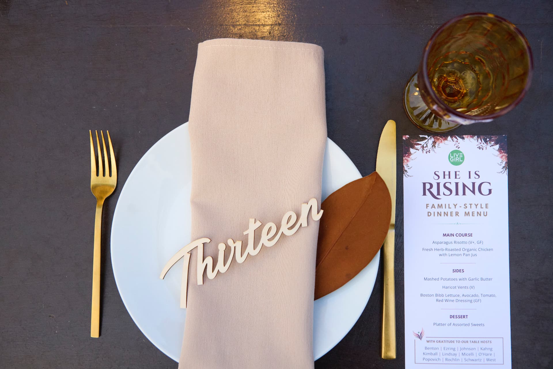 A She Is Rising place setting prepared for dinner