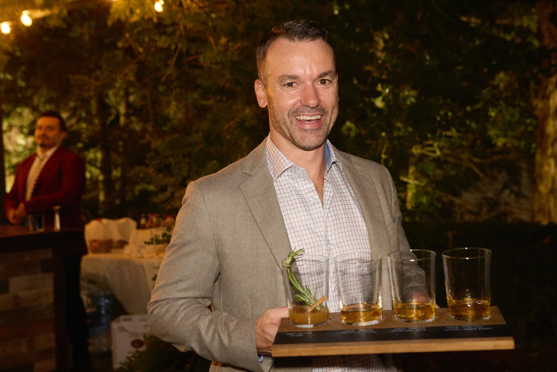 A guest carrying a tasting flight