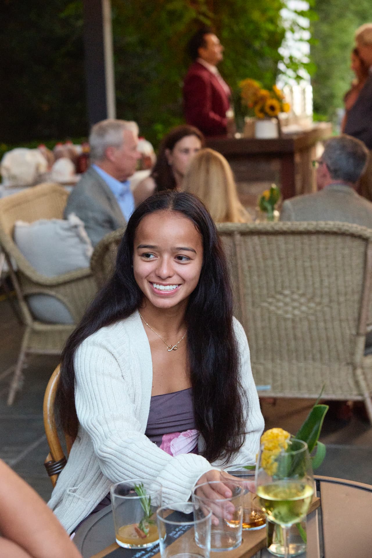 A LiveGirl girl smiling at dinner