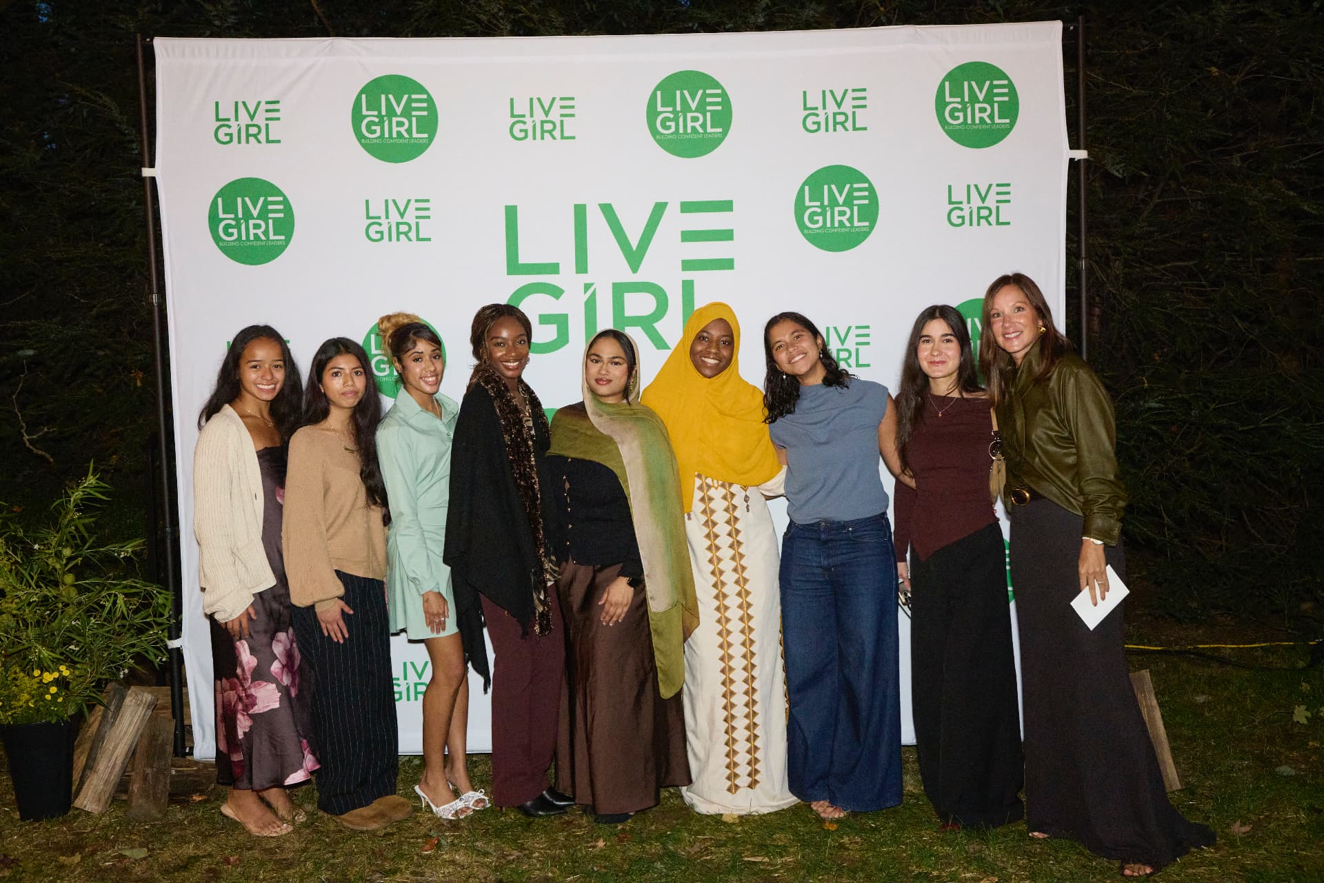 LiveGirl girls and leaders together at the step-and-repeat