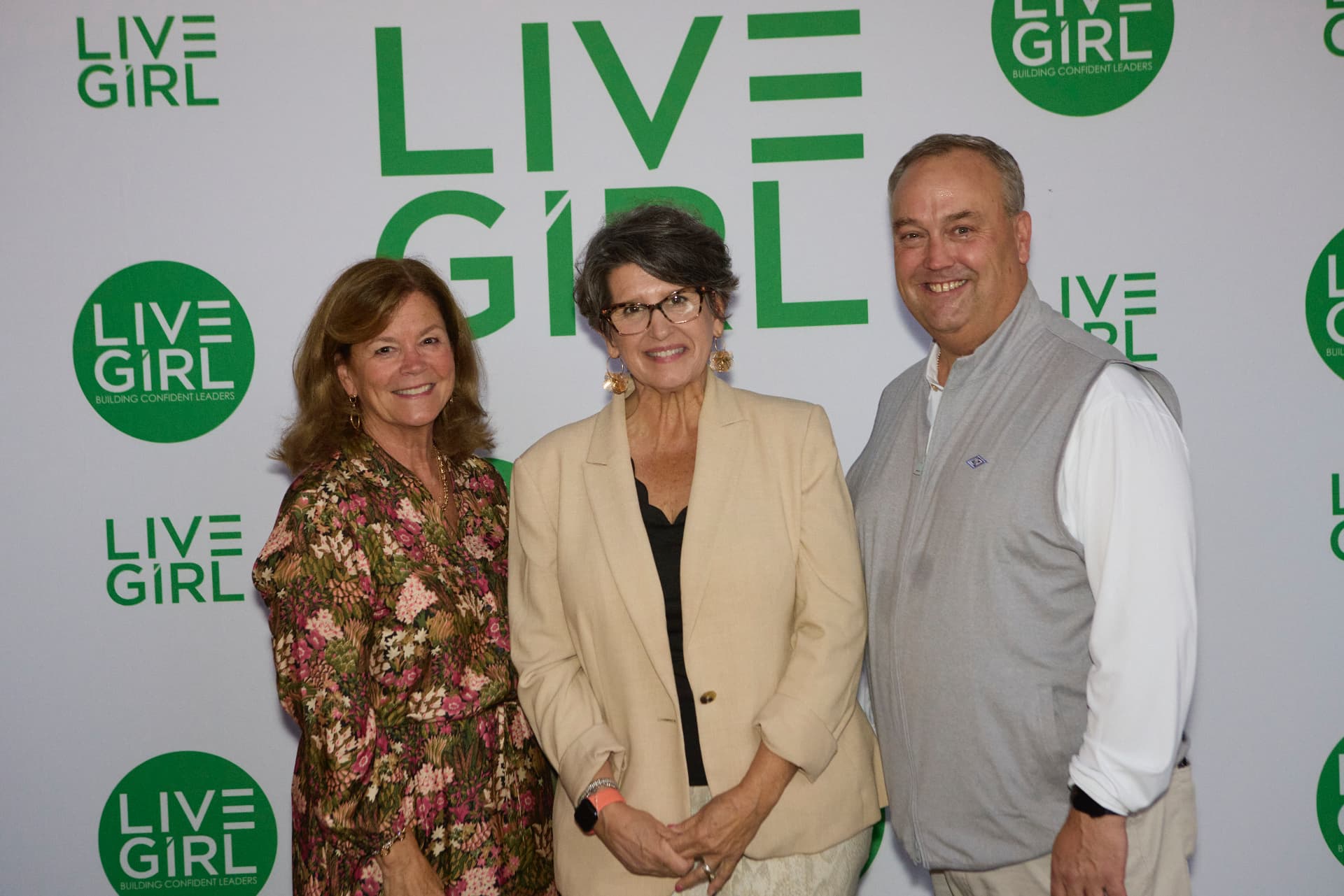 Guests at the LiveGirl step-and-repeat