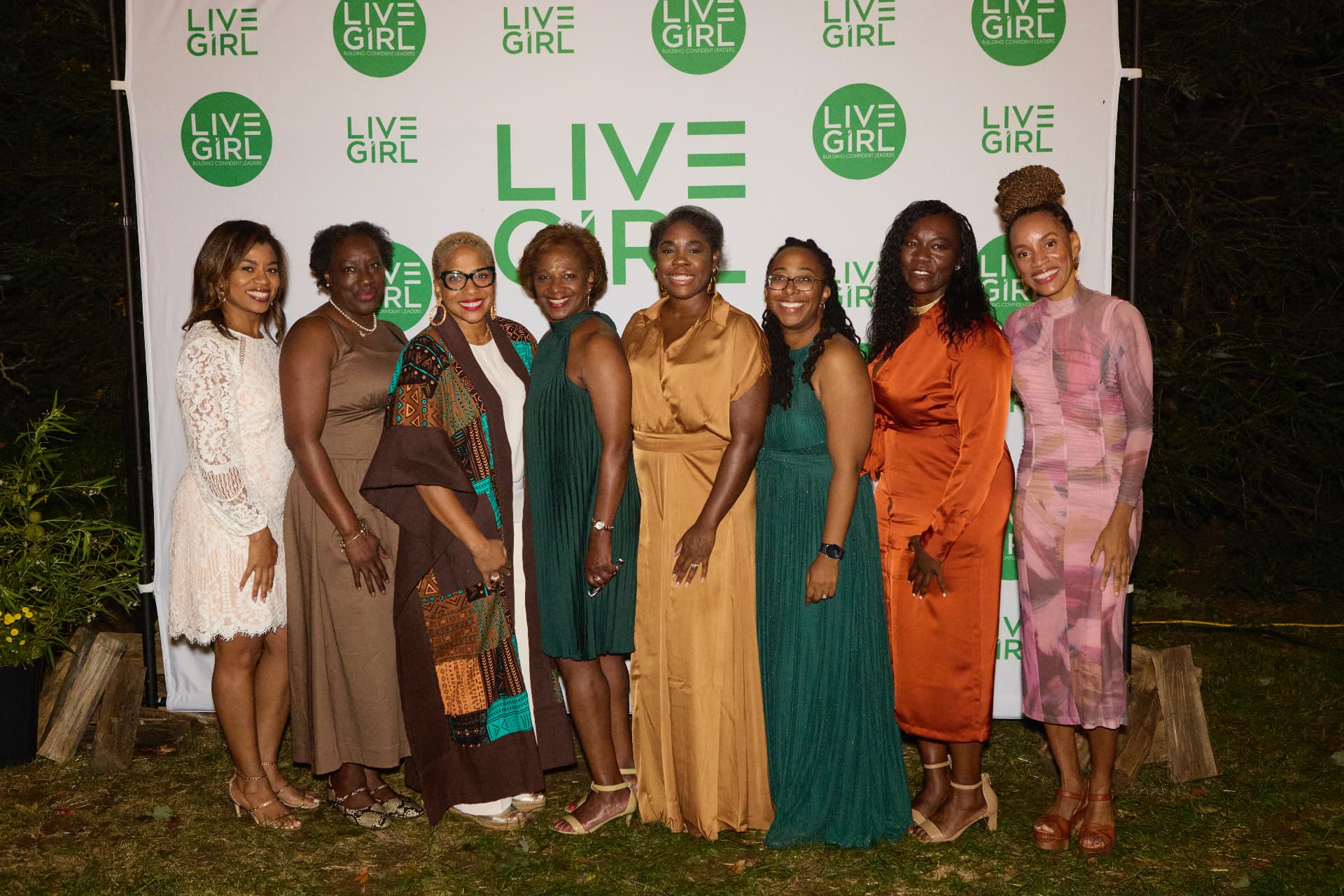 Creme of Nature's Nikia Bowman and guests at the LiveGirl step-and-repeat