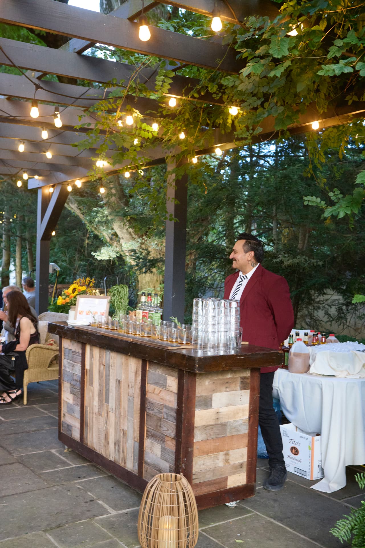 Drinks served from the garden bar beneath string lights