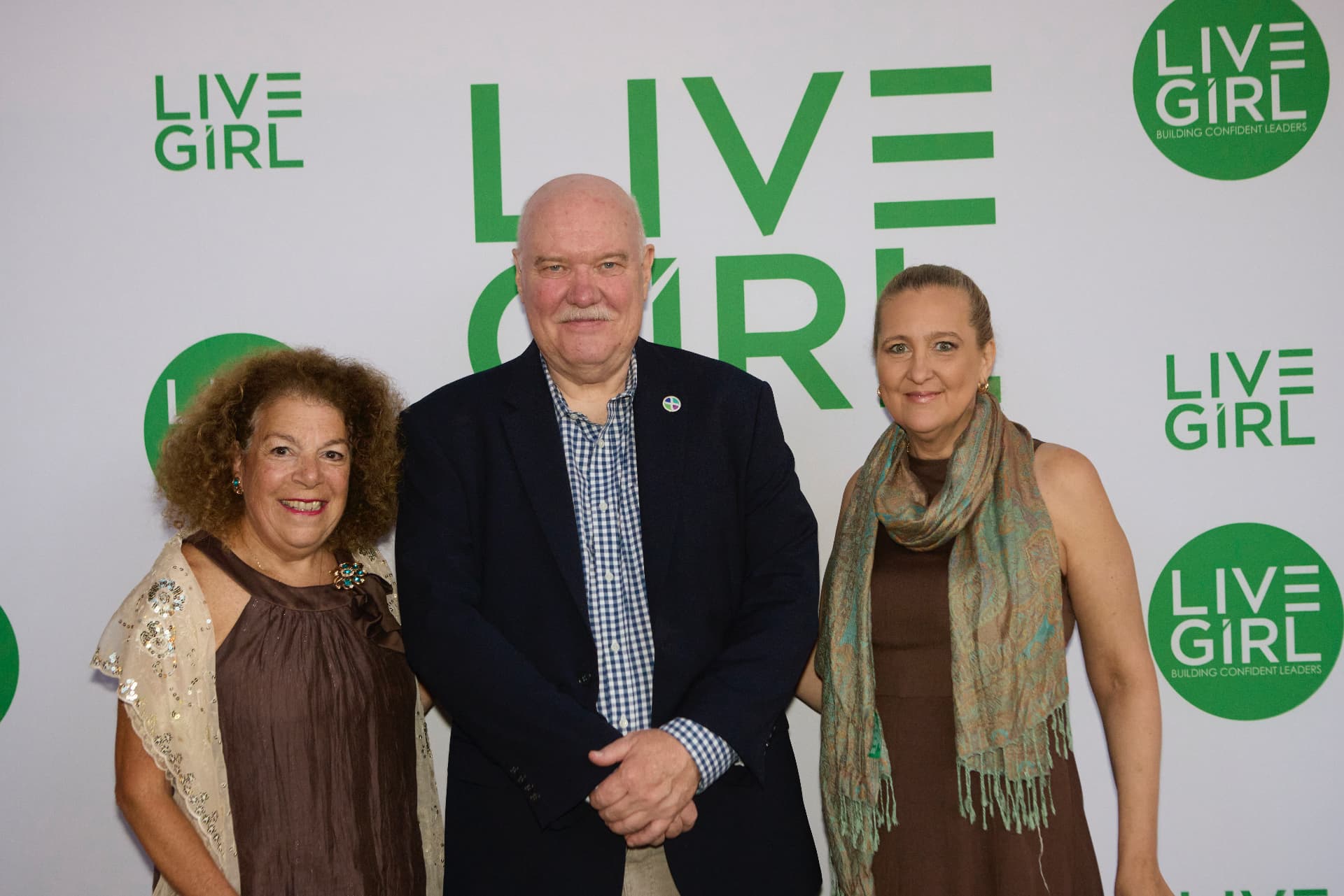 Partners from HTMX at the LiveGirl step-and-repeat